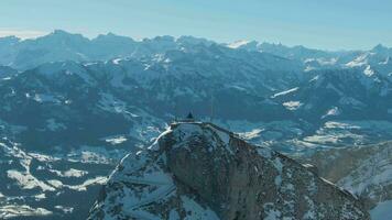 Mountain Pilatus Peak in Winter Sunny Day. Swiss Alps, Switzerland. Aerial View. Drone Flies Upwards, Tilt Down video