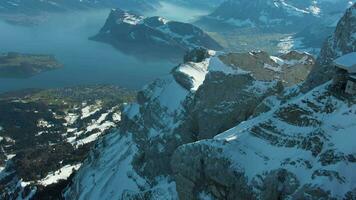 Mountain Pilatus and Lake Lucerne in Sunny Winter Morning. Swiss Alps, Switzerland. Aerial View. Drone Flies Forward, Tilt Up. Reveal Shot video