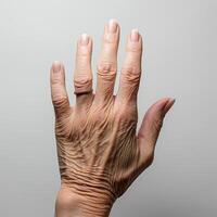 The back of an elderly woman's hand on a light background, wrinkled palms of old women, view of a wrinkled hand.Generative AI photo