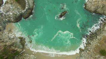 McWay Beach, McWay Falls and Rocks. Big Sur, California, USA. Aerial Vertical Top-Down View. Drone Flies Upwards video