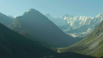 Altai Mountains and Mount Belukha in Summer Morning. Russia. Aerial View. Drone Flies Sideways and Upwards video