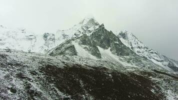 Ama Dablam Mountain and Cloudy Sky. Himalaya, Nepal. Aerial View. Drone Flies Forward video