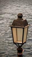 Lamp post on the coast photo