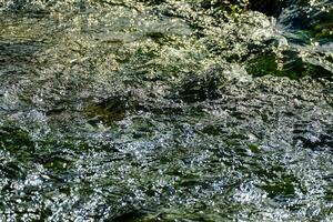 Flowing stream of water photo