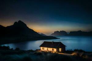 un pequeño cabina se sienta en el borde de un lago a noche. generado por ai foto