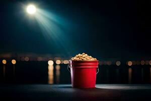 un Cubeta de palomitas de maiz en un mesa en frente de un ciudad a noche. generado por ai foto