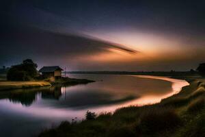 un casa se sienta en el apuntalar de un lago a puesta de sol. generado por ai foto