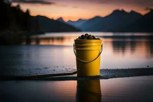 a bucket of rocks on the shore of a lake. AI-Generated photo