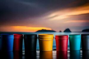 colorful buckets on a table with a sunset in the background. AI-Generated photo