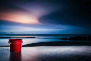 a red bucket sits on the floor in front of the ocean. AI-Generated photo