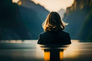 un mujer sentado en el agua mirando a montañas. generado por ai foto