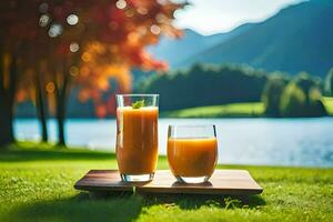 dos lentes de naranja jugo en un de madera bandeja en frente de un lago. generado por ai foto