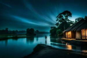a hut sits on the shore of a river at night. AI-Generated photo