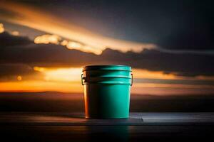 a green bucket sitting on a table in front of a sunset. AI-Generated photo