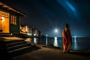 a man in an orange robe stands on the shore at night. AI-Generated photo