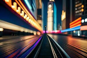 un tren pista en frente de un ciudad a noche. generado por ai foto