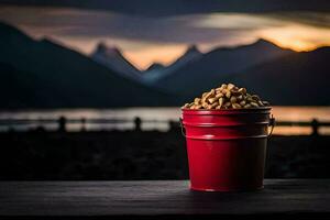 a bucket of peanuts on a table in front of a lake. AI-Generated photo
