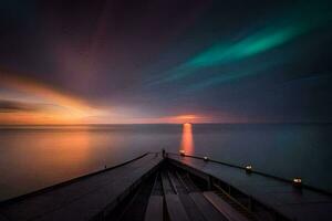 un barco es atracado a el final de un muelle a puesta de sol. generado por ai foto