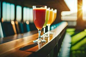 three glasses of juice are lined up on a bar. AI-Generated photo