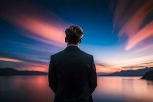 a man in a suit stands in front of a lake at sunset. AI-Generated photo