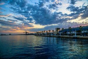 landscape after sunset on the port of Alicante Spain sky with clouds photo