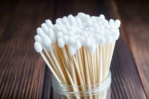 hygienic ear cotton buds in a box on a wooden countertop. AI Generative photo