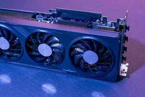 modern powerful gaming graphics card for a computer with three fans photo