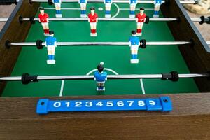 Close-up of figures of plastic players in a football match. photo