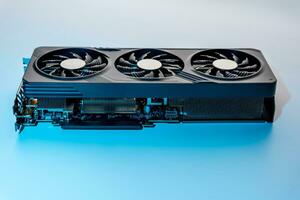 modern powerful gaming graphics card for a computer with three fans photo