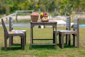 bread and fruit on the table in the garden.  image selective focus photo