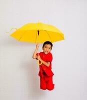 little boy fashion Smiling child in red chinese dress, style and fashion ideas for children. chinese new year photo