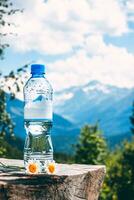 Water bottle on the background of the mountain, mock-up photo