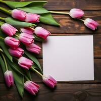 mockup white paper with tulip on the table photo