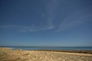 warm night at the sandy beach at the red sea on vacation photo