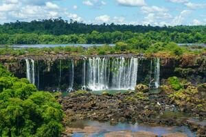 Iguazu Falls is a series of waterfalls on the border of Brazil and Argentina photo