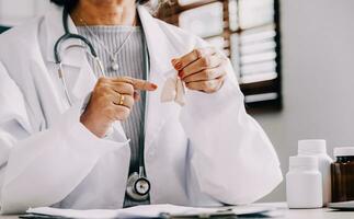 Female doctor holding virtual Lungs in hand. Handrawn human organ, copy space on right side, raw photo colors. Healthcare hospital service concept stock photo