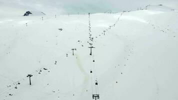 Gondolas in the ski resort aerial view video