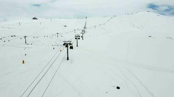 Gondolas in the ski resort aerial view video