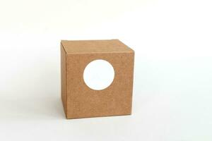 Round sticker mockup on gift square craft box, tech box and blank sticker, adhesive label photo