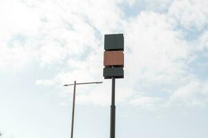 Blank billboard mockups on a tall pole. three billboards with different textures. wooden billboard photo