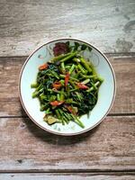 A plate of chilli spinach stir fry photo