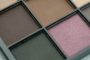 Make-up palette close up. Professional multicolor eye shadow make-up palette. Cosmetic products photo