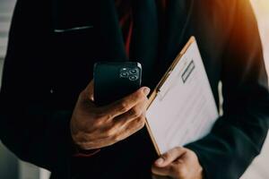 Close up view of job interview in office, focus on resume writing tips, employer reviewing good cv of prepared skilled applicant, recruiter considering application, hr manager making hiring decision photo