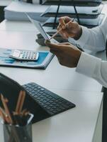 Close up of Business team analyzing income charts and graphs with modern laptop computer. Business analysis and strategy concept. photo