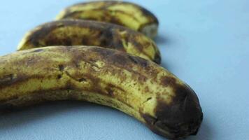 comparing rotten banana with a ripe banana on a white background video