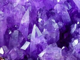 purple amethyst crystals as background photo