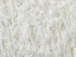 texture of a white fluffy wool background. photo