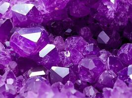 purple amethyst crystal on the black background photo