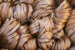 Thick Golden bundle of raw jute fiber abstract Pattern Texture Can be used as a Background wallpaper photo