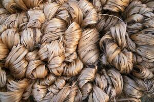 Thick Golden bundle of raw jute fiber abstract Pattern Texture Can be used as a Background wallpaper photo